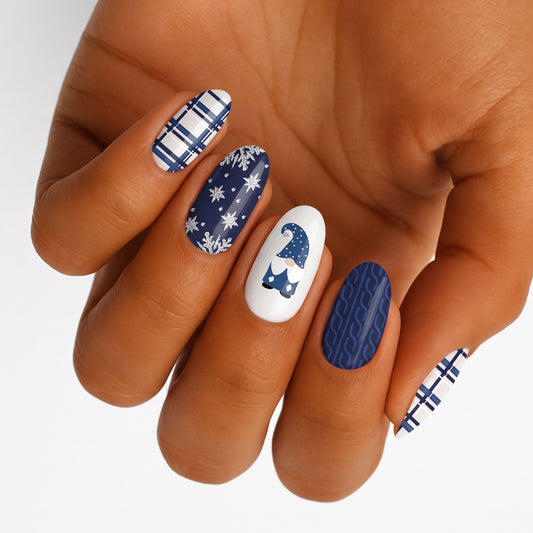 Navy and white nail wraps with plaid, snowflakes, cable-knit and gnome design