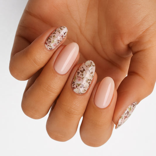 Nude glossy semi-cured gel nails with mixed ditsy floral accent nails, oval shape