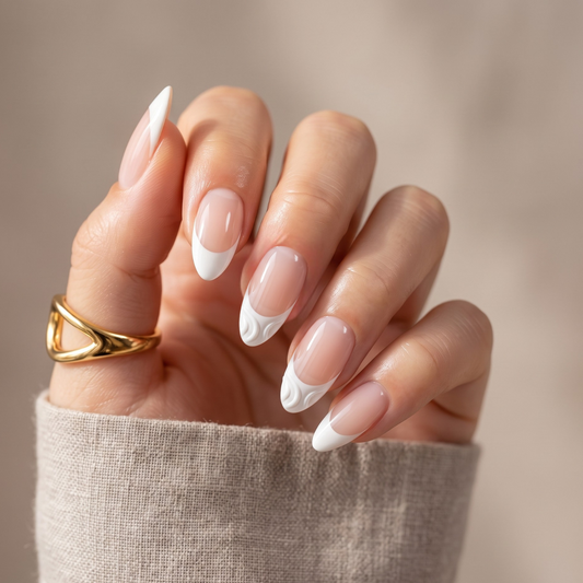Glossy white French tip nail wraps with wavy swirl accent on nude almond nails