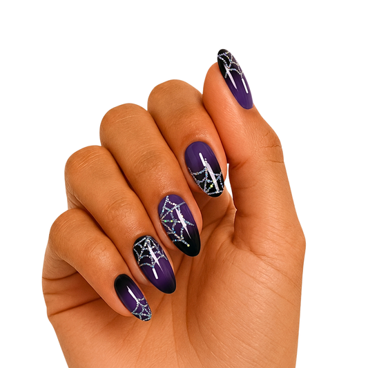 Purple-to-black ombré semi-cured gel nails with glittery silver spiderweb design, glossy finish.