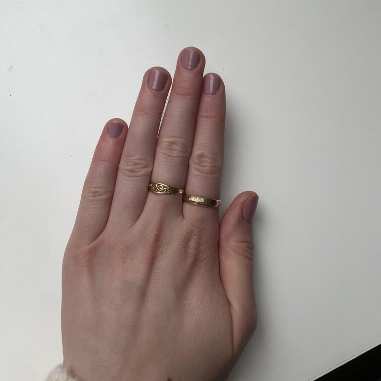 Dusty rose gel nail wraps on hand displaying matte nude pink manicure