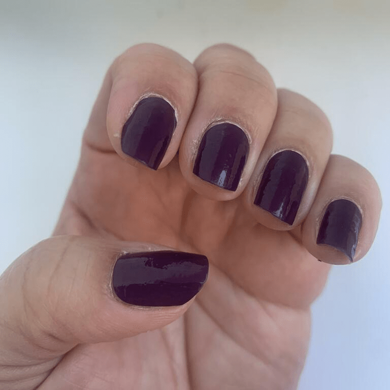 Mulberry purple glossy nail wraps on hand displaying rich colour manicure