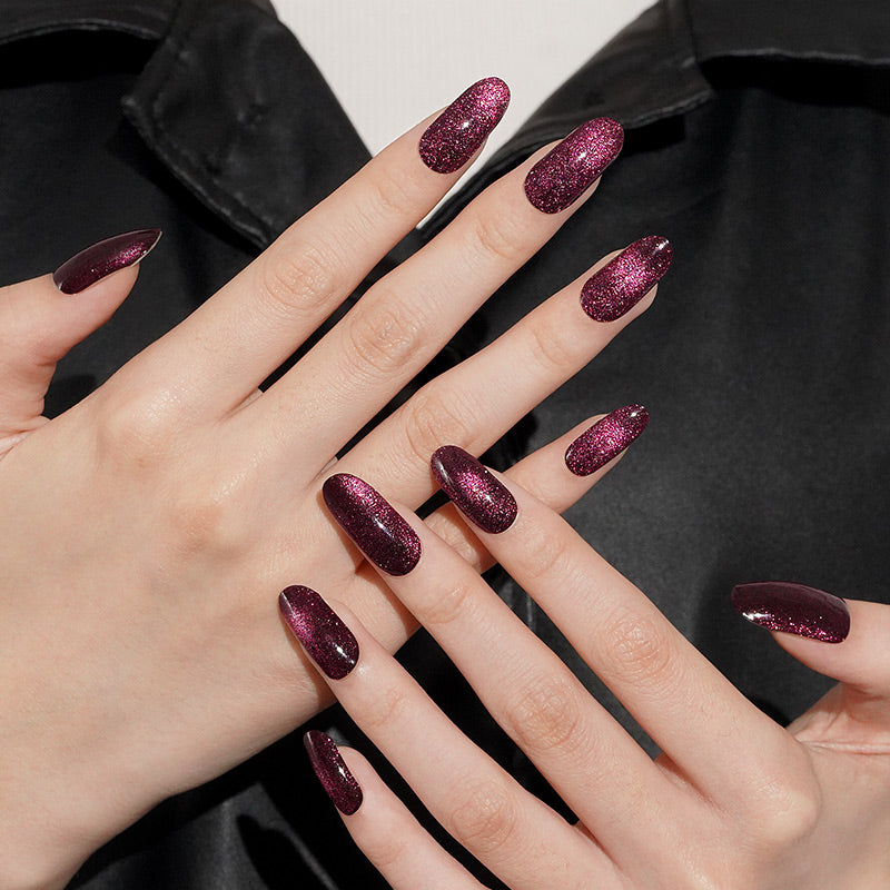 Deep burgundy glitter press-on nails with high-shine finish on coffin-shaped tips