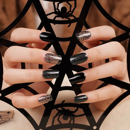 Black semi-cured gel wraps with glitter, glossy and sheer cobweb-print Halloween accents
