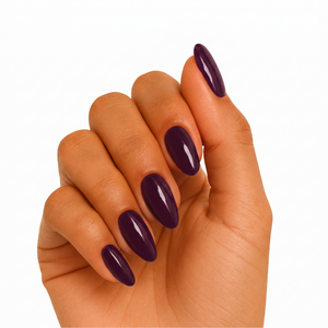 Deep plum glossy semi-cured gel nail wraps on almond-shaped nails