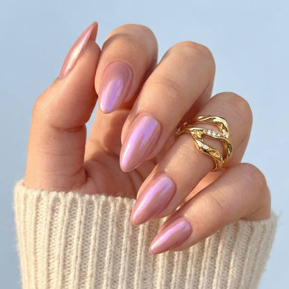 Pink chrome glazed almond press-on nails with glossy metallic finish on hand