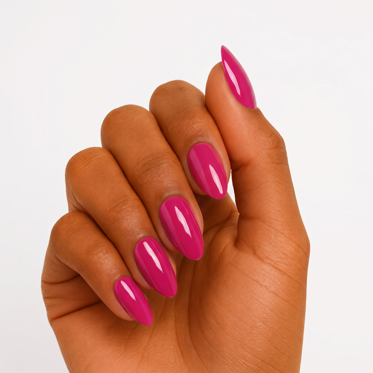Glossy magenta pink semi-cured gel nail wraps on almond-shaped nails