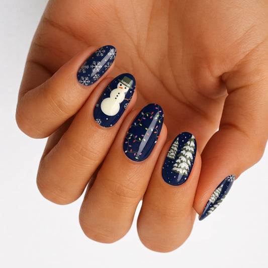 Navy blue nail wraps with snowman, snowflakes, fairy lights and snowy pine tree designs