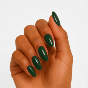 Solid dark green glossy press-on nails in almond shape on medium skin tone hand