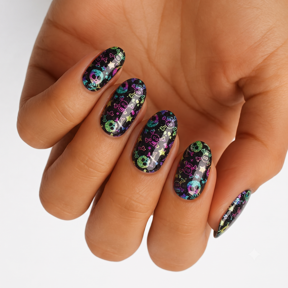 Black holographic nail wraps with colourful skull, crossbones and star motifs