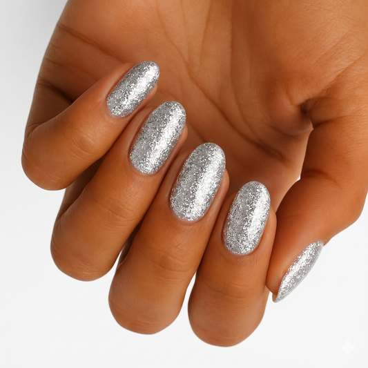 Silver glitter nail wraps on hand with sparkly metallic finish for party look