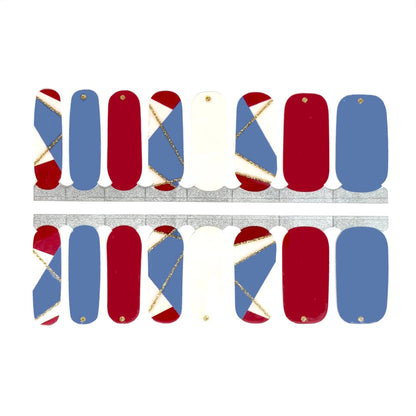 Red, blue, and cream nail wraps with gold geometric crisscross accents, glossy finish.