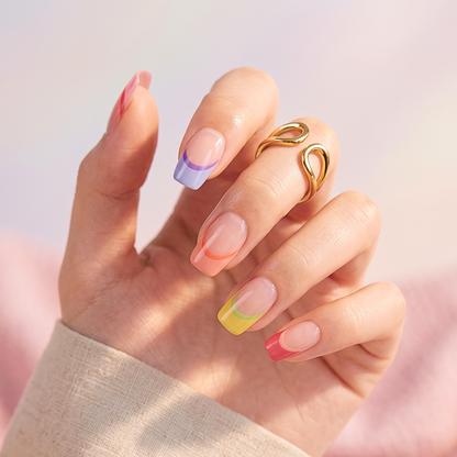 Semi-cured gel nail wraps with sheer nude base and multicolor rainbow French tips, glossy finish.