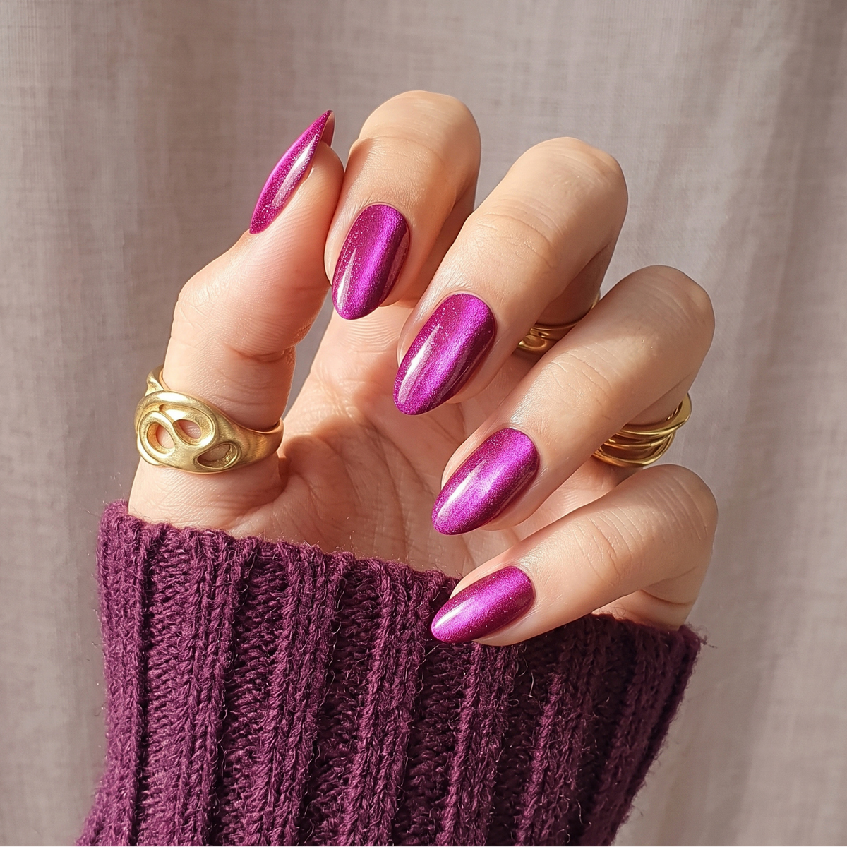 Magenta pink shimmer semi-cured gel nail wraps on almond-shaped press-on nails
