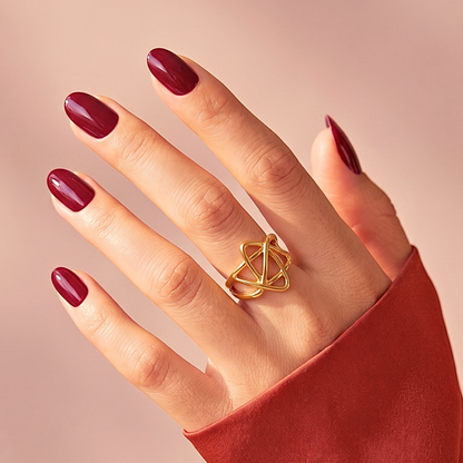 Glossy deep burgundy semi-cured gel nail wraps on short round almond nails.
