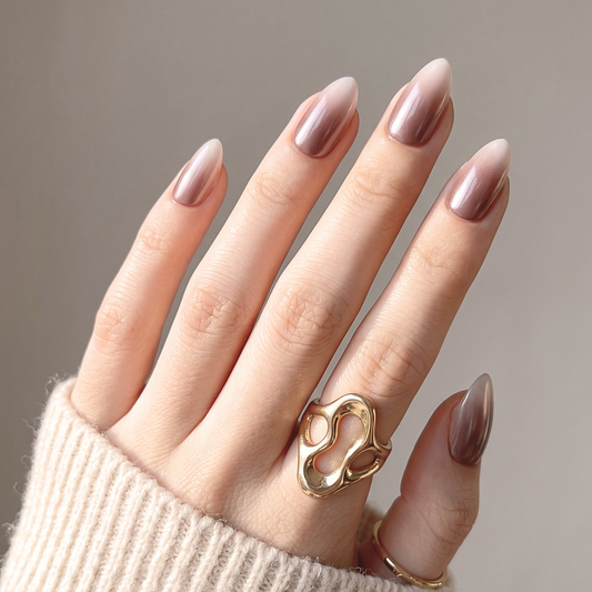 Almond press-on nails with mauve-brown chrome ombré fading to sheer nude tips