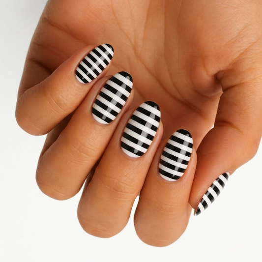Glossy black and white horizontal striped semi-cured gel nail wraps, almond shape.