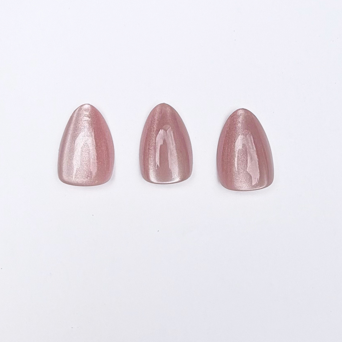 Metallic rose pink press-on nails, short round almond shape, shimmering chrome finish
