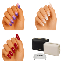 Purple burgundy nude gel nail wraps on hands with UV lamp and travel bag starter kit