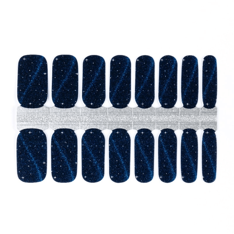 Dark blue gel nail wraps with star glitter pattern cosmic design