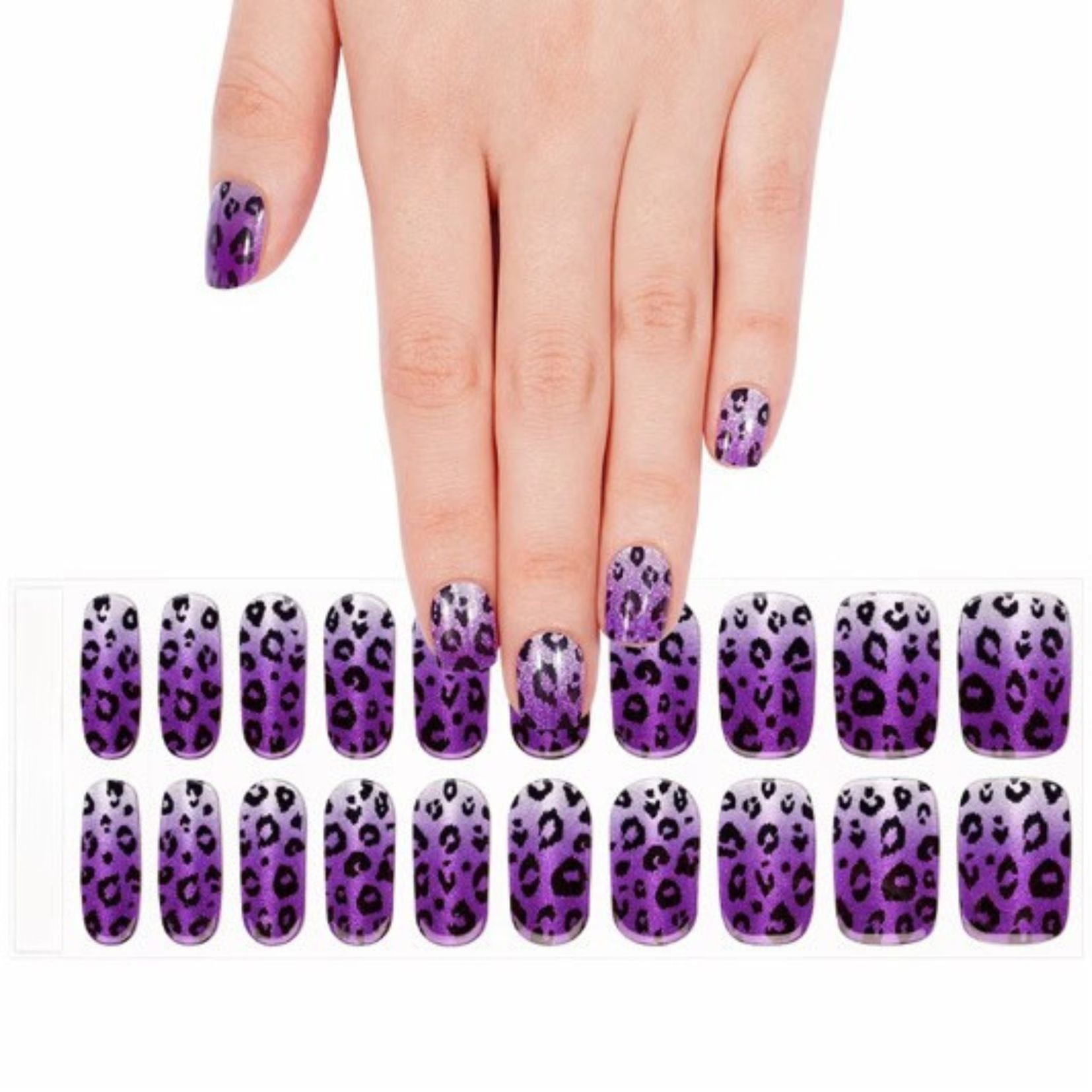 Purple leopard print gel nail wraps on hand with matching nail art sheet