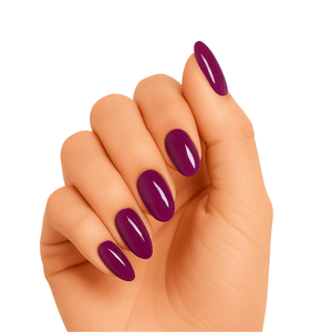 Deep burgundy claret gel nail wraps on hand showing glossy manicure finish