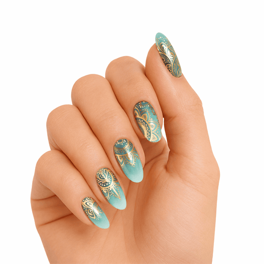 Jade green gel nail wraps with gold mandala pattern on hand showing bohemian nail art