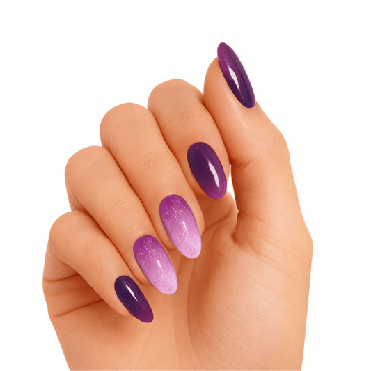 Purple gradient gel nails on hand showing ombre manicure from light to dark