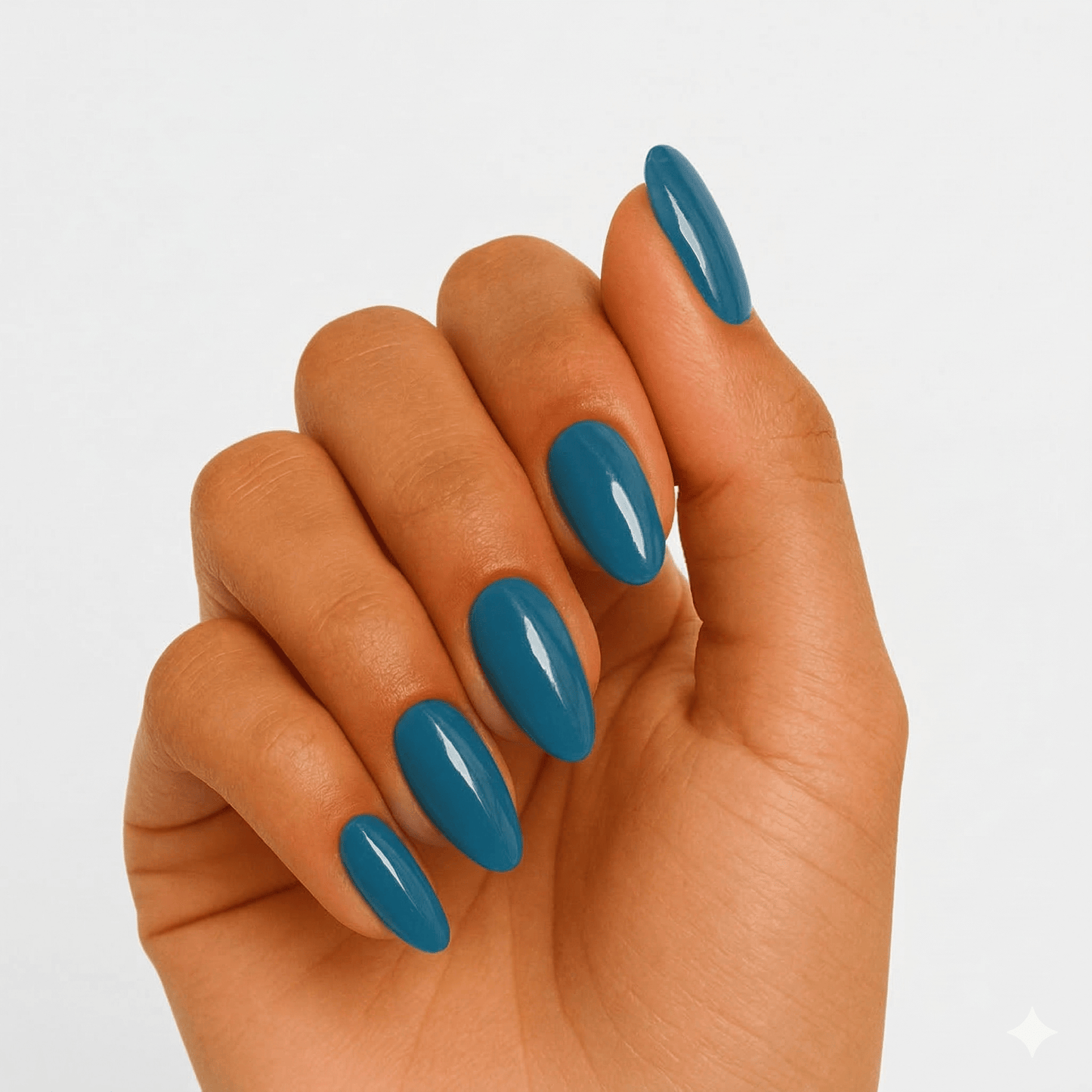 Hand wearing glossy teal semi-cured gel nails in almond shape for professional manicure