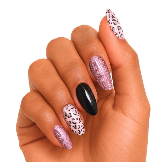 Mixed nail art on hand featuring black glossy, rose gold glitter, leopard print gel wraps